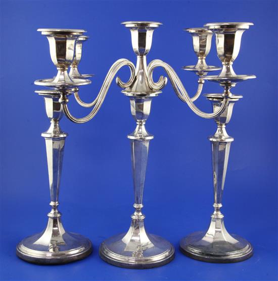 A 1960s silver candelabrum & a pair of similar candlesticks,